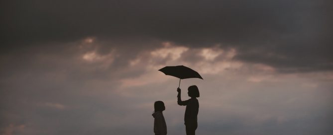 holding umbrella for someone